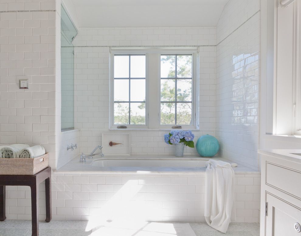 Subway Tile Patterns for a Beach Style Bathroom with a White and Shelter Island Beach House by Wettling Architects