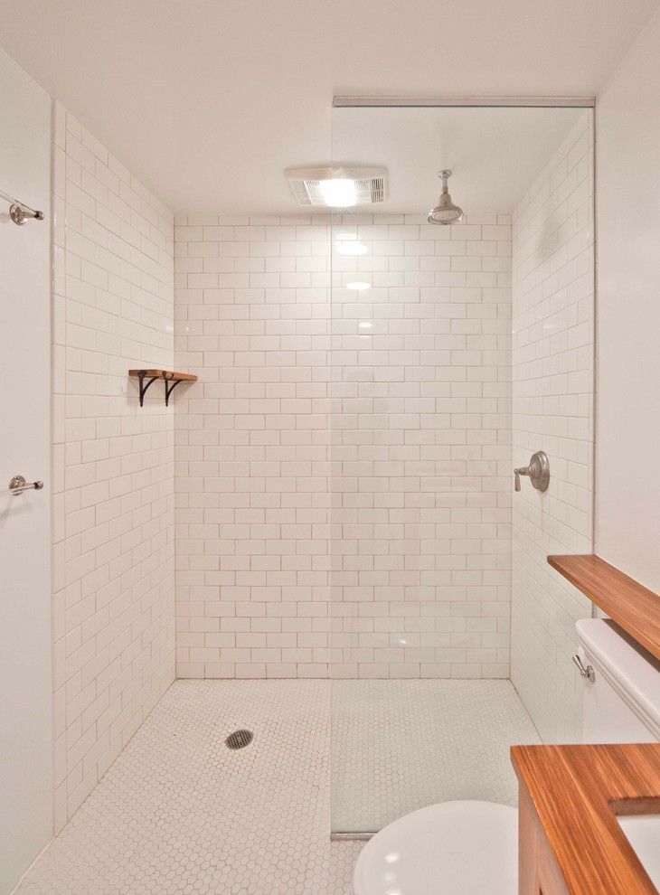 Subway Tile Patterns for a Contemporary Bathroom with a Floating Shelves and Parkslope Townhouse by Grant Davis Thompson, Inc.