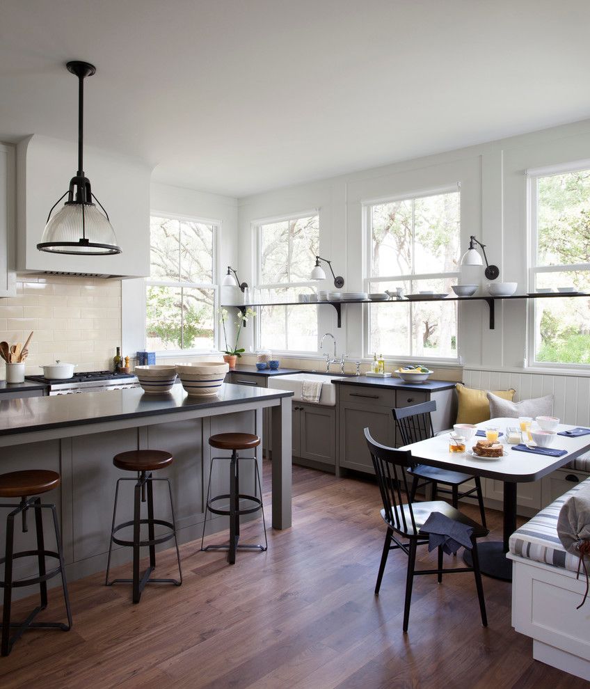 Sun Valley Bronze for a Farmhouse Kitchen with a Lantern Wall Sconce and Modern Farm House by Tim Cuppett Architects