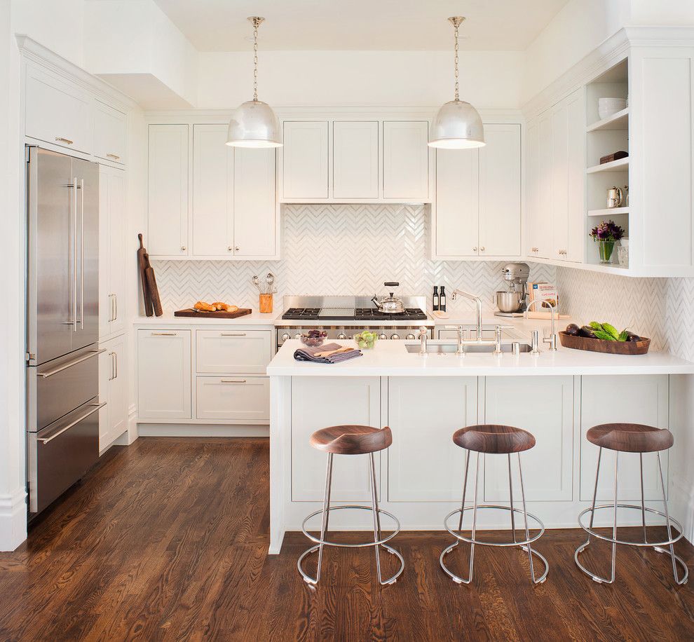 Sun Valley Bronze for a Transitional Kitchen with a Peninsula Sink and Noe Valley Kitchen by Jute Interior Design