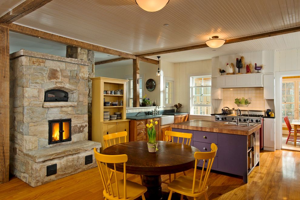 Super White Quartzite for a Farmhouse Kitchen with a Rustic Wood Ceiling Beams and Leed Platinum Home by Phinney Design Group