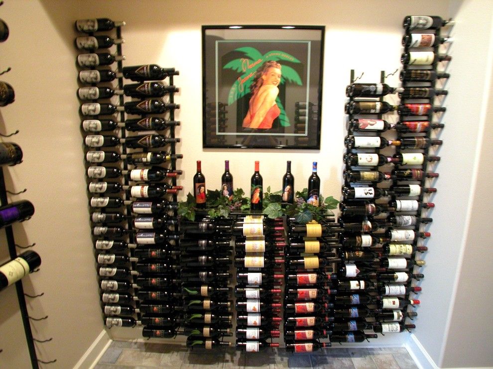 Superior Moulding for a Contemporary Wine Cellar with a Vintage View and Wine Bottle Storage by Superior Moulding of Nevada