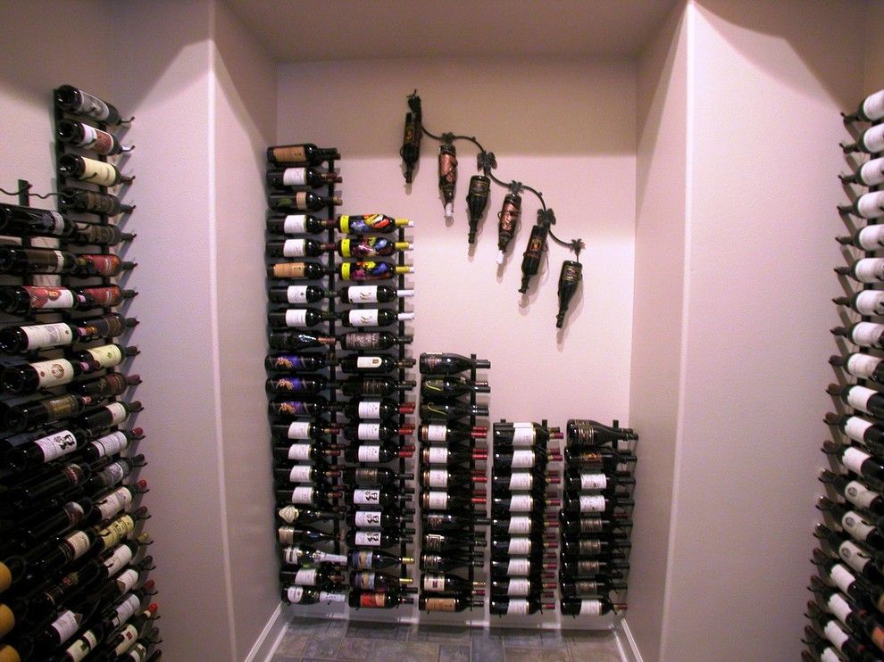 Superior Moulding for a Contemporary Wine Cellar with a Wine Racks and Wine Bottle Storage by Superior Moulding of Nevada
