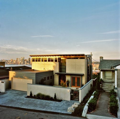 Swenson Granite for a Modern Exterior with a Front Garden and Rhodes Architecture + Light by Rhodesarchitecture