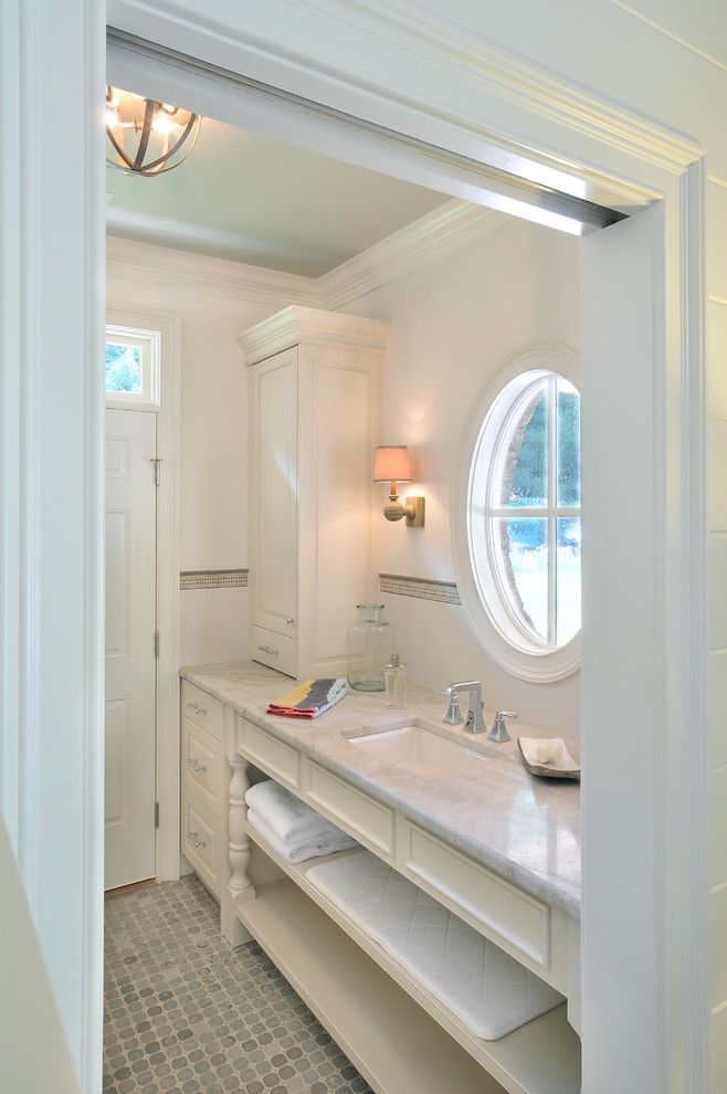 Taj Mahal Granite for a Traditional Bathroom with a Pocket Door and Pool House by Innovative Construction Inc.