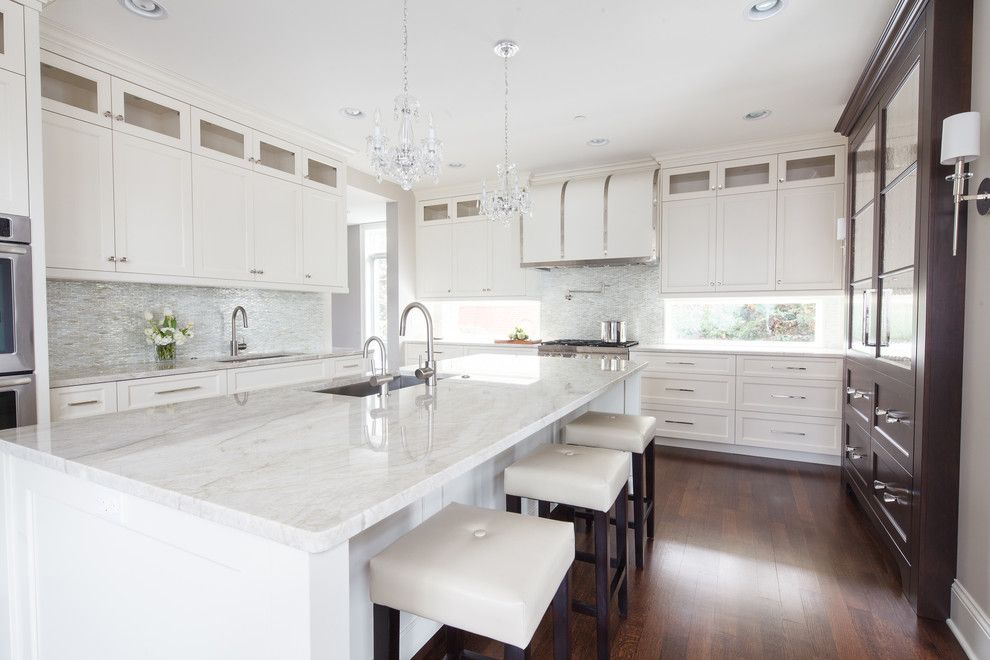 Taj Mahal Granite for a Traditional Kitchen with a Beige Bar Stool and Lincolnwood Living by Amrami Design Group