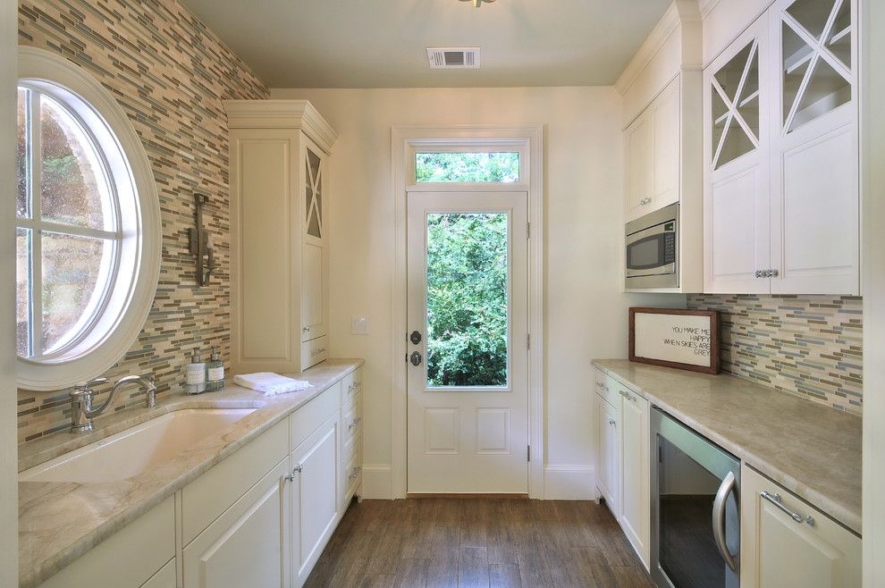 Taj Mahal Granite for a Traditional Kitchen with a Gray Ceiling and Pool House by Innovative Construction Inc.