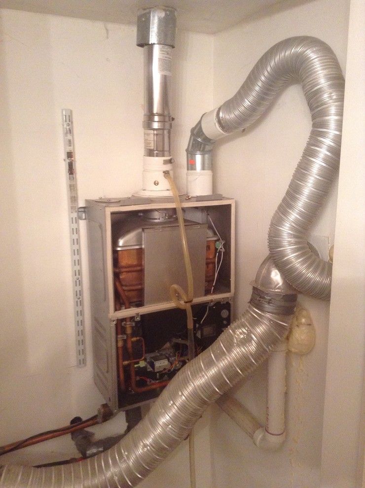 Tankless Water Heater vs Tank for a Craftsman Closet with a Plumbing and Tankless Water Heaters by Anything Maintenance, Llc