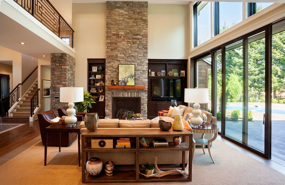 T&d Furniture for a Transitional Living Room with a Stacked Stone Fireplace and the American Dream | 2013 Street of Dreams by Westlake Development Group, Llc