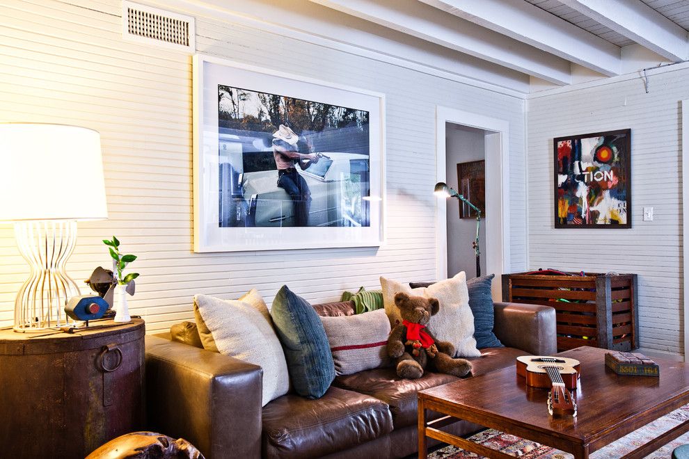 Teddy Bear Pools for a Eclectic Family Room with a Large Artwork and Island Dwelling by Cortney Bishop Design