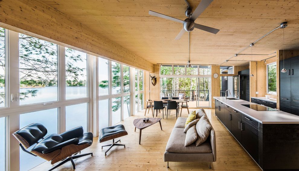 Texas Casual Cottages for a Contemporary Living Room with a Dark Wood Kitchen and La Peche Cottage   Kariouk & Associates by Photolux Commercial Studio