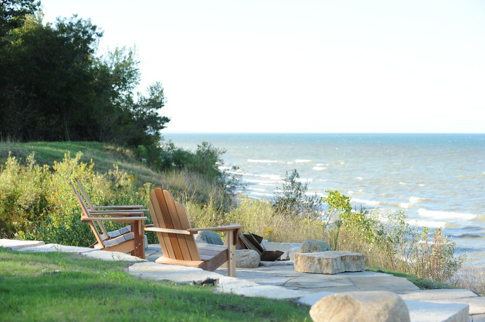 Texas Casual Cottages for a Traditional Landscape with a Retaining Wall and Green Cottage by Cottage Home, Inc.