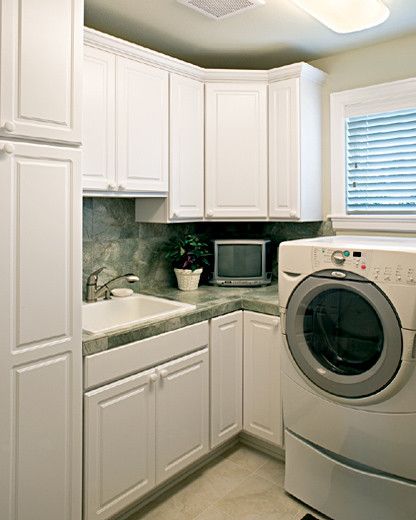 Thermofoil for a Mediterranean Laundry Room with a Cornerstone and Canyon Creek Cornerstone   Glacier Bay Doors Styles in White Thermofoil by Canyon Creek Cabinet Company