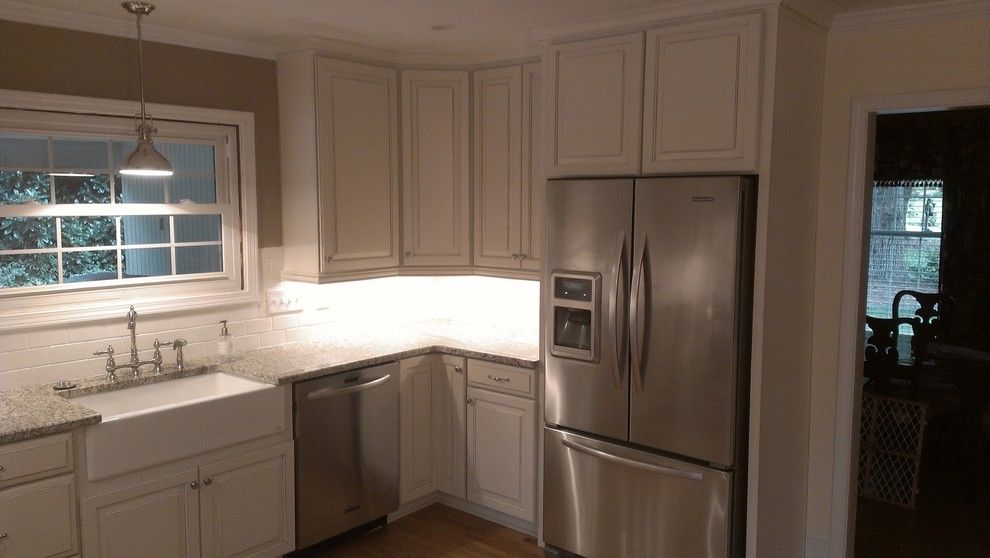 Timberlake Cabinets for a Traditional Kitchen with a Farmhouse Sink and Fairvalley Kitchen by Carolina Custom Homes and Renovations,Llc