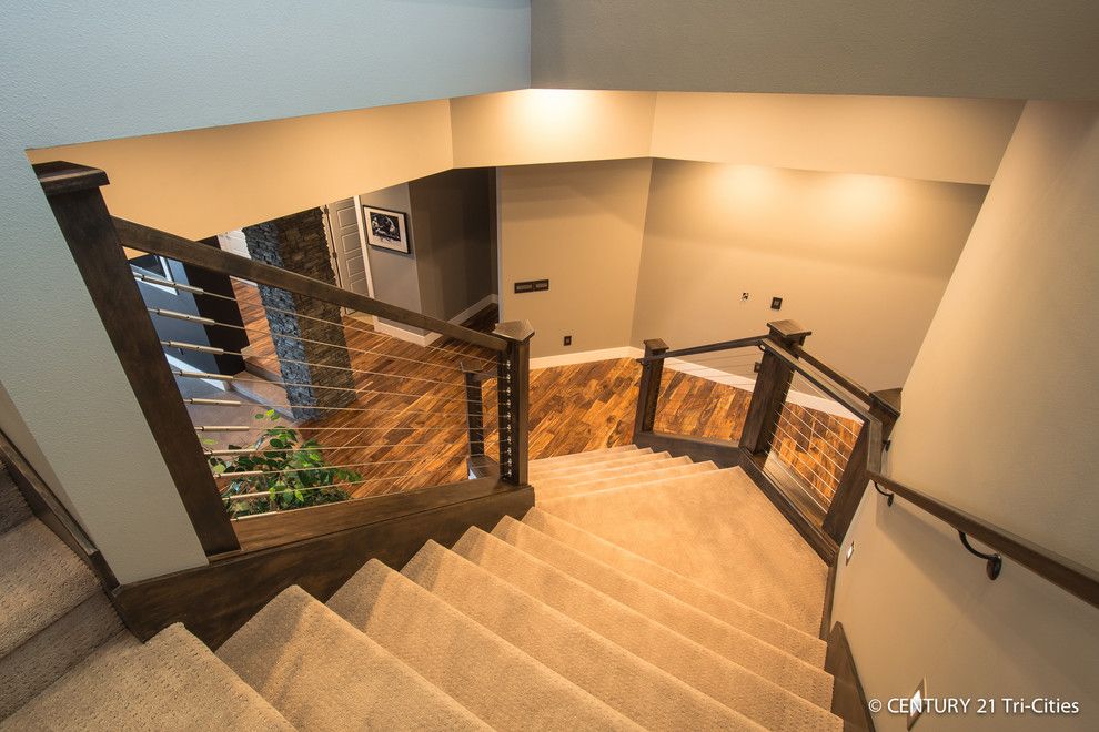 Titan Homes for a Contemporary Staircase with a Cable Railing and Legacy   2014 Parade by Titan Homes Llc