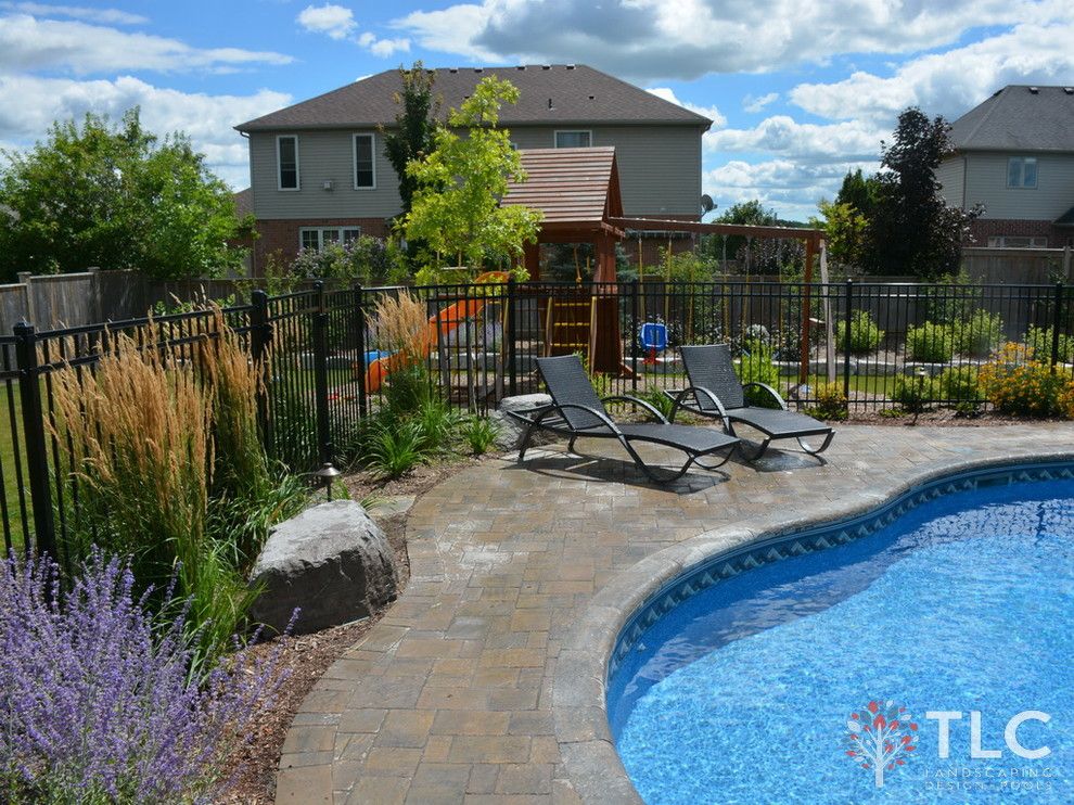 Tlc Landscaping for a Traditional Landscape with a Stones Walling and Larouche Residence by Tlc Landcaping Design + Pools