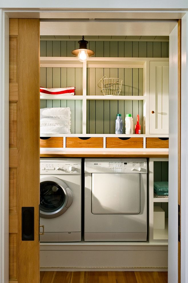 Top Load vs Front Load Washing Machine for a Beach Style Laundry Room with a Pendant Lighting and Laundry Room by Whitten Architects