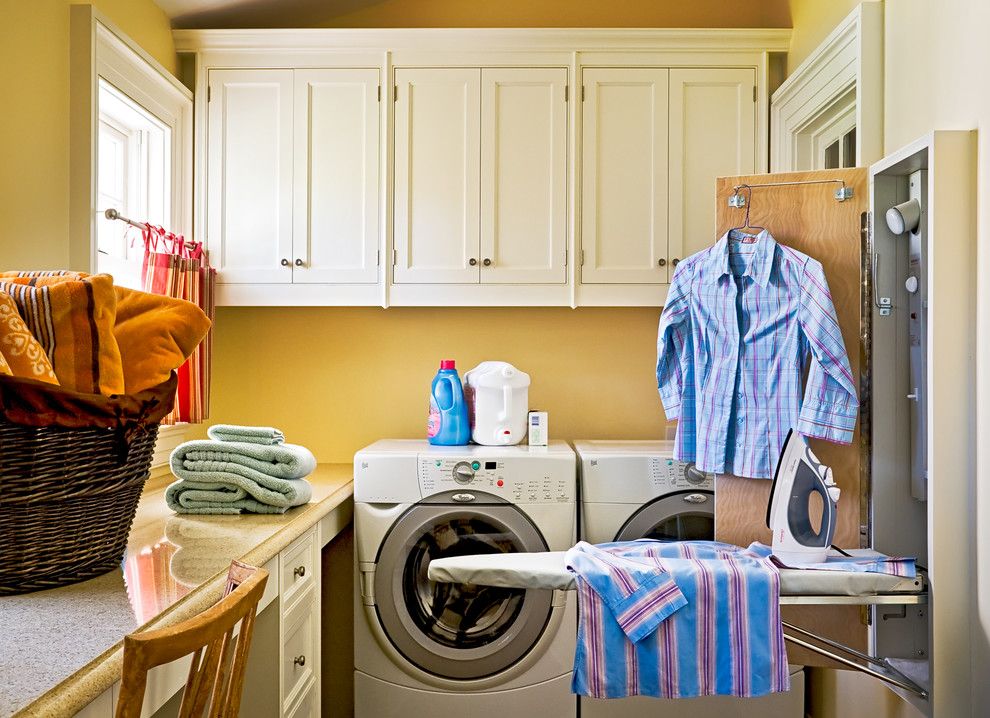 Top Load vs Front Load Washing Machine for a Traditional Laundry Room with a Wood Cabinets and Crisp Architects by Crisp Architects