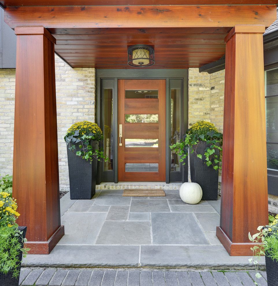 Top Loader vs Front Loader for a Contemporary Entry with a Wood Column and Milwaukee Bluff House by Karen Kempf Interiors