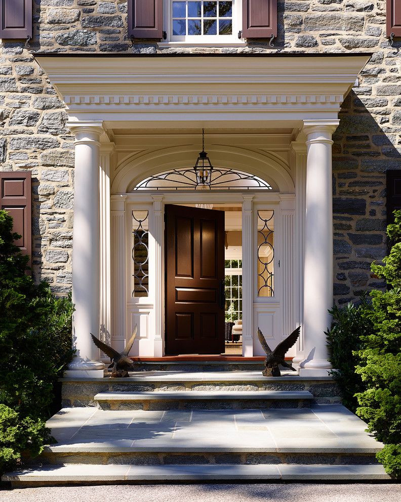 Top Loader vs Front Loader for a Traditional Entry with a Arch Window and Bryn Mawr Stone Colonial by Pinemar, Inc