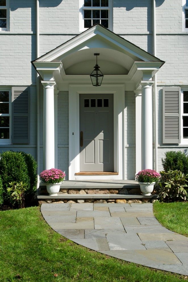 Top Loader vs Front Loader for a Traditional Entry with a Hanging Outdoor Lantern and Huestis Tucker Architects, Llc by Huestis Tucker Architects, Llc