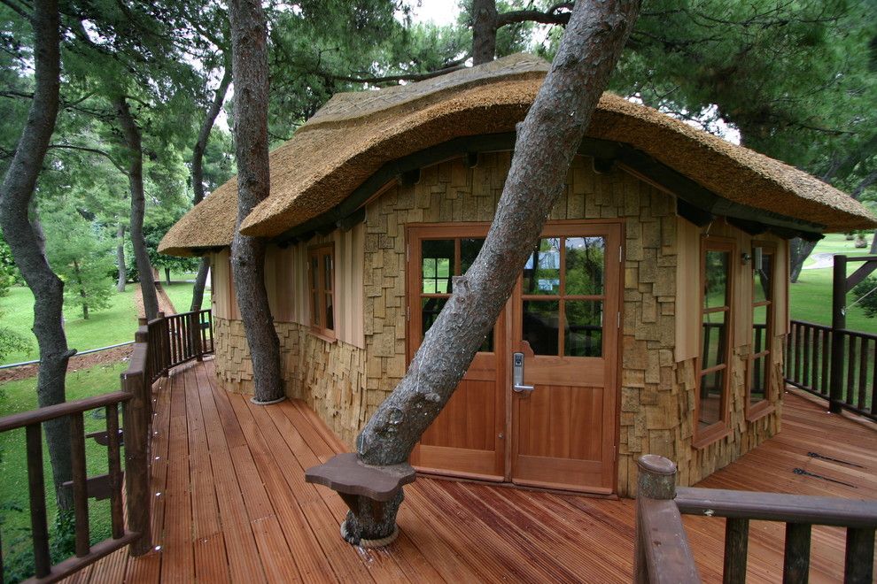 Treehouse Designs for a Rustic Shed with a Thatched Roof and Blue Forest Tree House by Blue Forest Uk Ltd