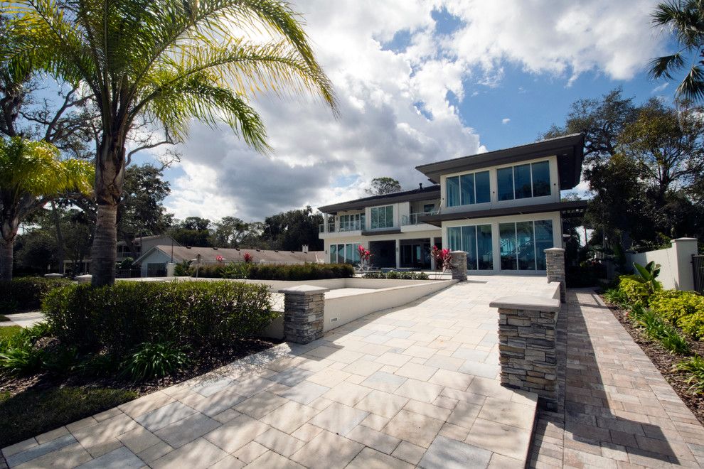 Tremron Pavers for a Contemporary Exterior with a Storefront Glass and Contemporary Riverfront Home by Forever Homes