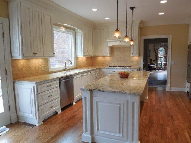 Triton Granite for a Traditional Kitchen with a Travertine Backsplash and Ferrari Kitchen by Triton Stone Group of Nashville