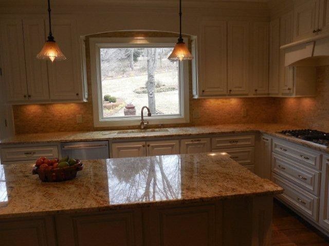 Triton Granite for a Traditional Kitchen with a Travertine Backsplash and Ferrari Kitchen by Triton Stone Group of Nashville