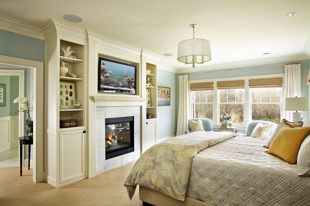 Ubuildit for a Traditional Bedroom with a Tv and Traditional Bedroom by Garrisonhullinger.com