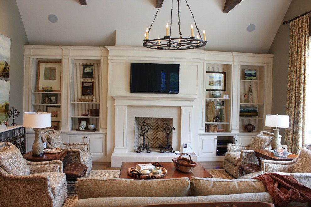 Ubuildit for a Traditional Living Room with a Brick and Family Room Built Ins by Wildwood Cabinetry