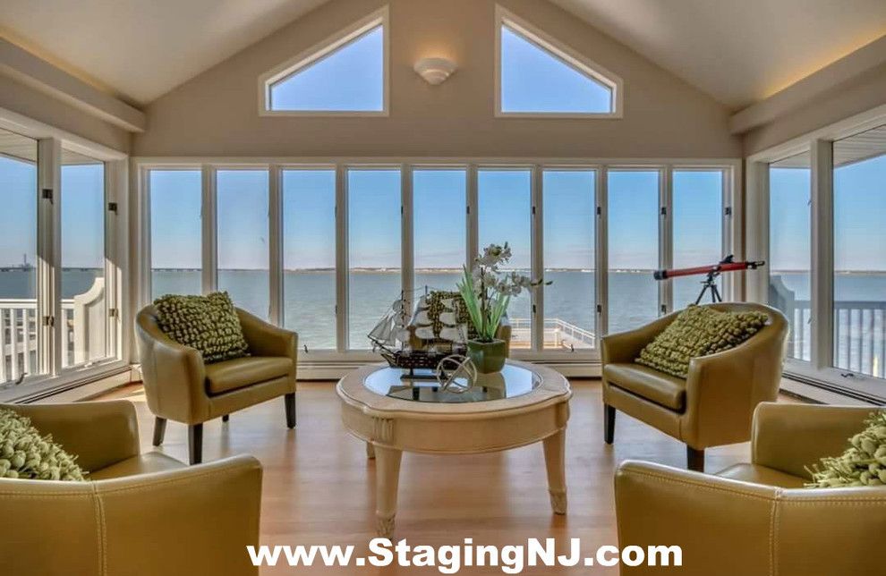 Value City Furniture Nj for a Beach Style Sunroom with a Monmouth County Nj Home Stagers and Luxury Home Staging in Ocean City, Nj  08226 Cape May County, Nj by Beautiful Interiors Design Group