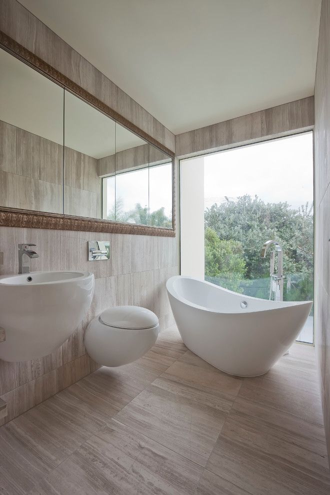 Vertical Bathtub for a Contemporary Bathroom with a Wall Mount Sink and Contemporary Washroom by Bespoke on Khyber