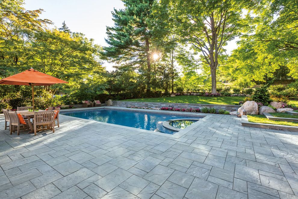 Vertical Bathtub for a Contemporary Spaces with a Stone Patio and Cambridge Pavingstones with Armortec by Cambridge Pavingstones with Armortec