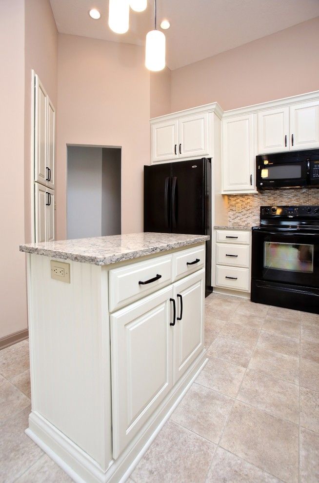 Viatera for a  Kitchen with a Glass Tile Backsplash and Louisville Handyman Job, Maple Painted Dover White by Southern Kitchens, Ltd. Co