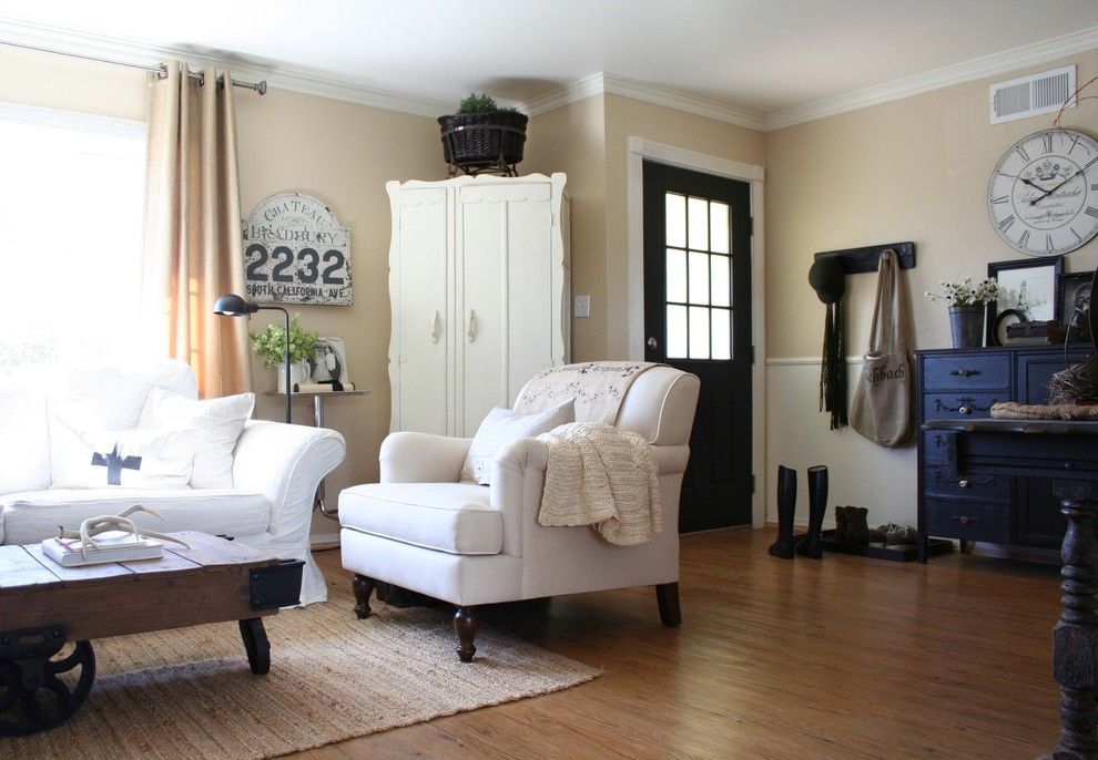 Vinyl vs Laminate for a Traditional Living Room with a Old Sign and Sunny and Bright Living Room by Jennifer Grey Interiors