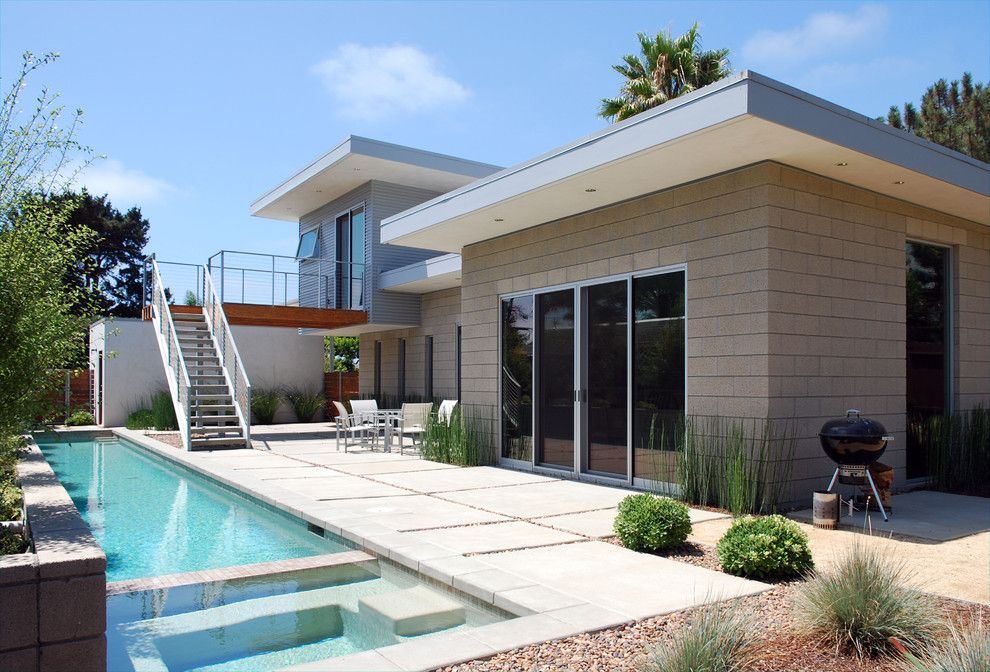 Vortex Doors for a Midcentury Exterior with a Modern Back Yard and North Rios Residence by Jlc Architecture