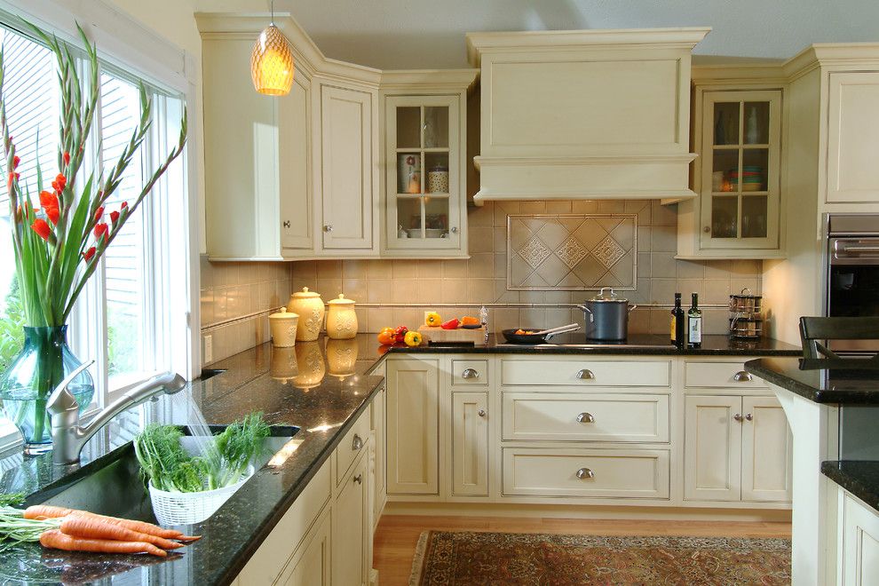 Vortex Doors for a Traditional Kitchen with a Beige Backsplash and Thomas Buckborough & Associates by Thomas Buckborough & Associates