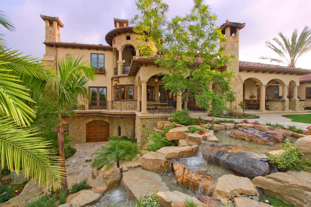 Walkout Basement for a Mediterranean Exterior with a Stone Exterior and Villa De Frazier by Arc Design Group