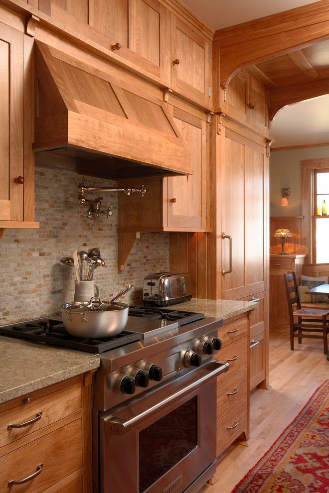 Water Spigot for a Craftsman Kitchen with a Wood Floor and Crocus Hill Residence by David Heide Design Studio