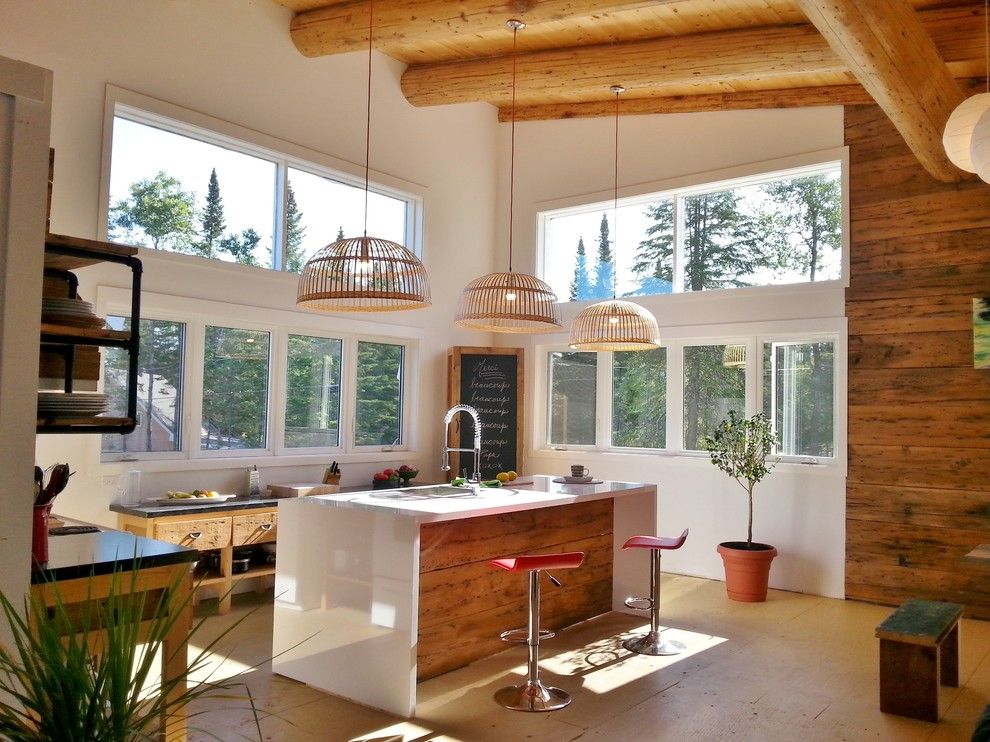 Waterfall Countertop for a Farmhouse Kitchen with a Wood Ceiling and Loft Lumineux by Oumf Design