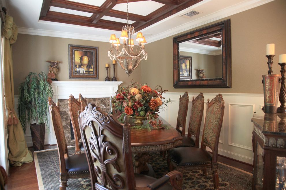 Waynes Coating for a Mediterranean Dining Room with a Mantel and Dining Room by J. Hettinger Interiors