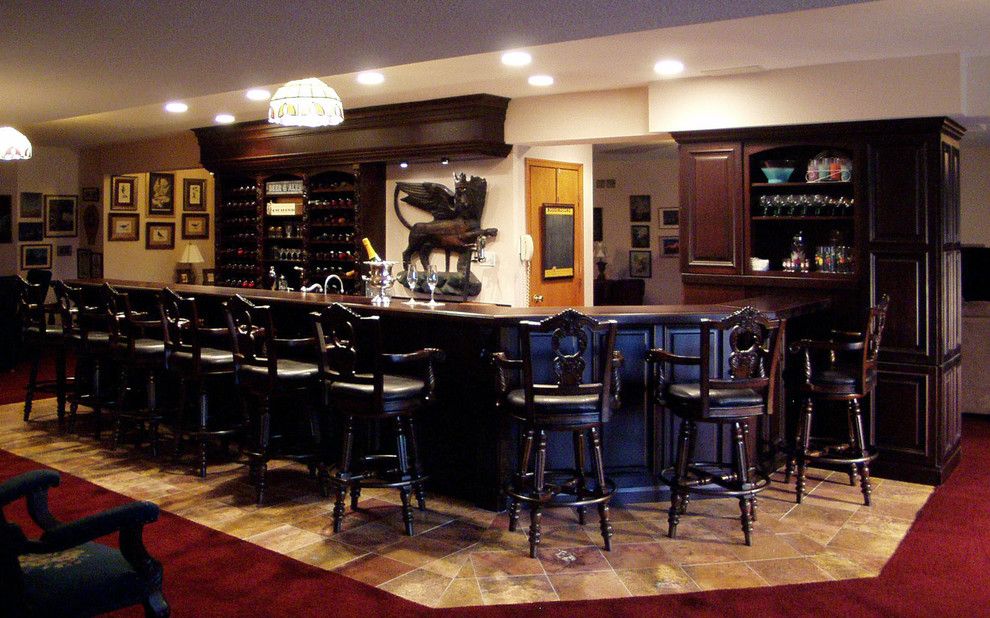 Wayside Furniture for a Traditional Basement with a Old World and English Pub Lower Level Bar by Kitchen Design Group