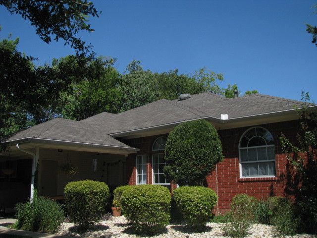 Weathered Wood Shingles for a Traditional Exterior with a Dallas Roofing Company and Weathered Wood Shingled Roof by Rhino Construction