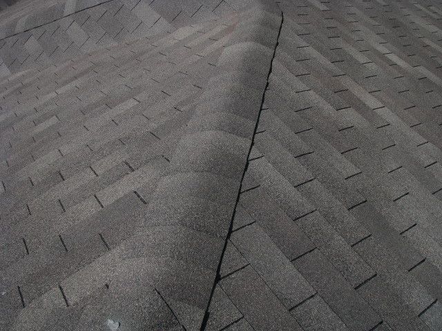 Weathered Wood Shingles for a Traditional Exterior with a Texas Roofing and Weathered Wood Shingled Roof by Rhino Construction