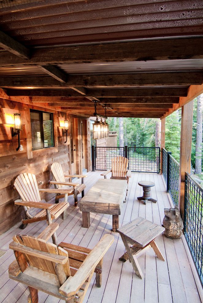 Wells Fargo Reo for a Rustic Deck with a Side Table and Beaver Pond by High Camp Home