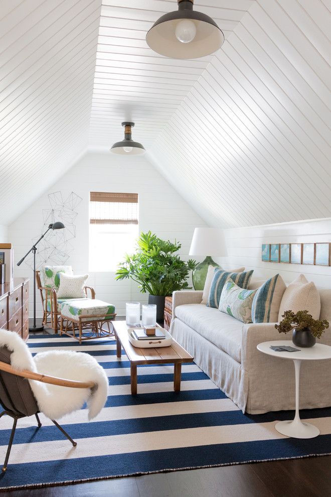 Wesley Hall Furniture for a Beach Style Family Room with a Floral Fabric and Attic Den by Matthew Caughy Interiors