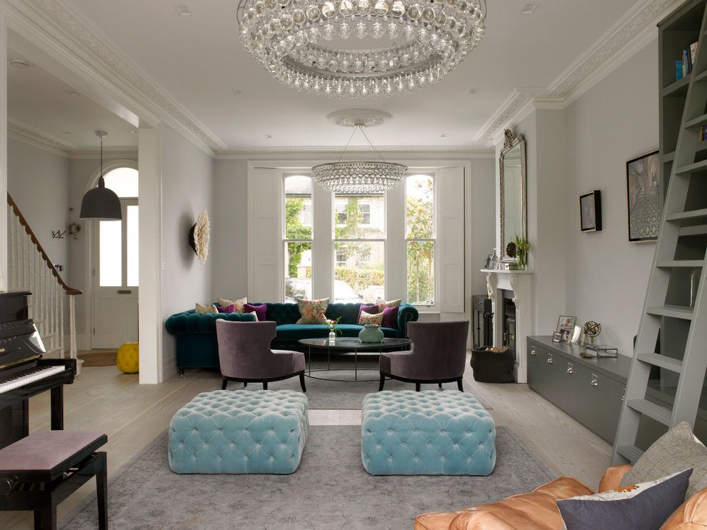 Wesley Hall Furniture for a Victorian Living Room with a Mantel Mirror and Wimbledon House by Stephen Fletcher Architects