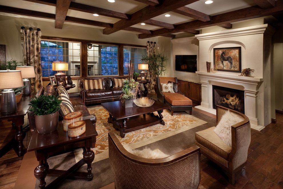 Western Heritage Furniture for a Mediterranean Family Room with a Fireplace and the Overlook at Heritage Hills by Celebrity Communities