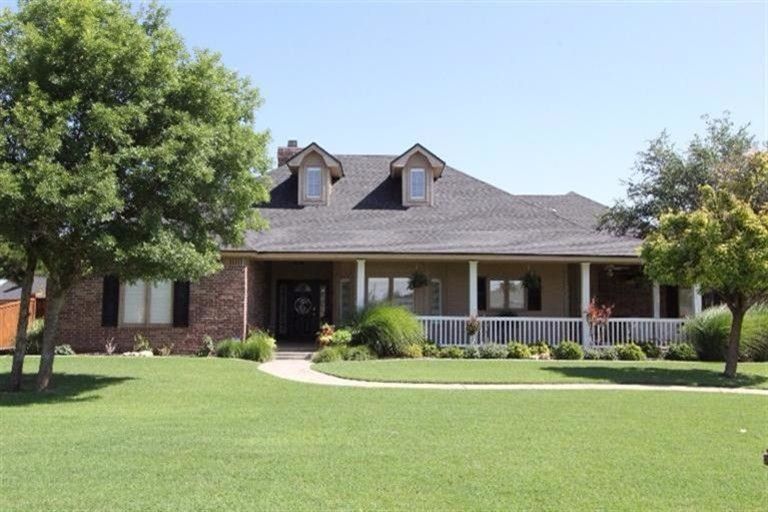 Westmark Realtors for a Traditional Exterior with a Front Porch and Real Estate Listing by Joy Daniel, Westmark Realtors